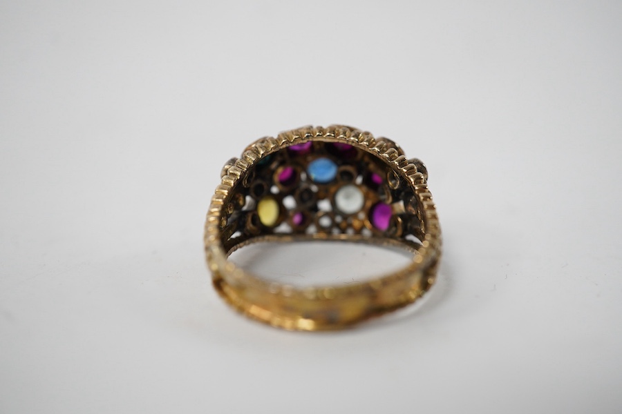 A 1940's continental yellow metal and multi gem set cluster dress ring, size P, gross weight 6.6 grams. Condition - poor to fair